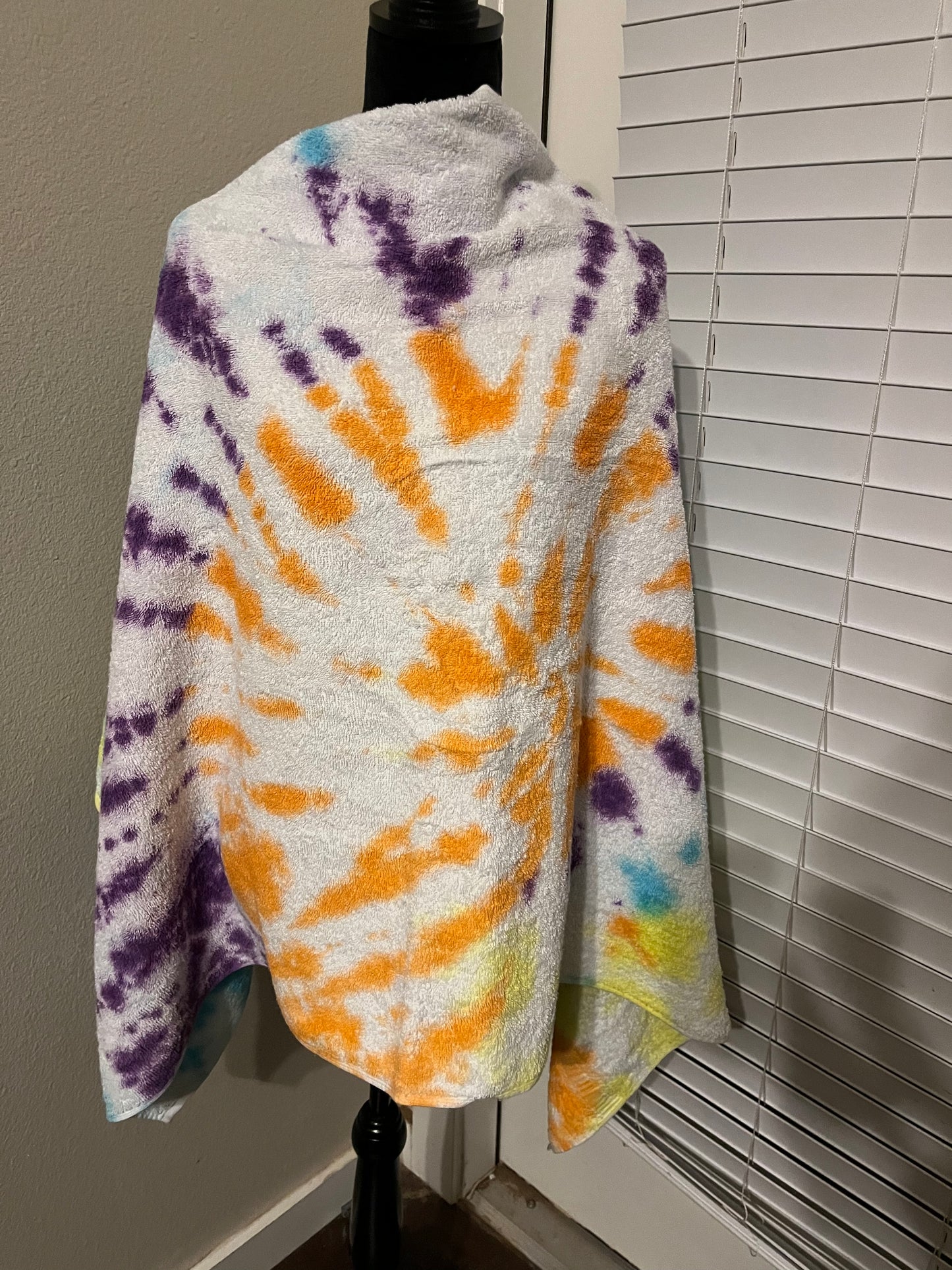 Yellow, purple, blue and orange tie dye towel