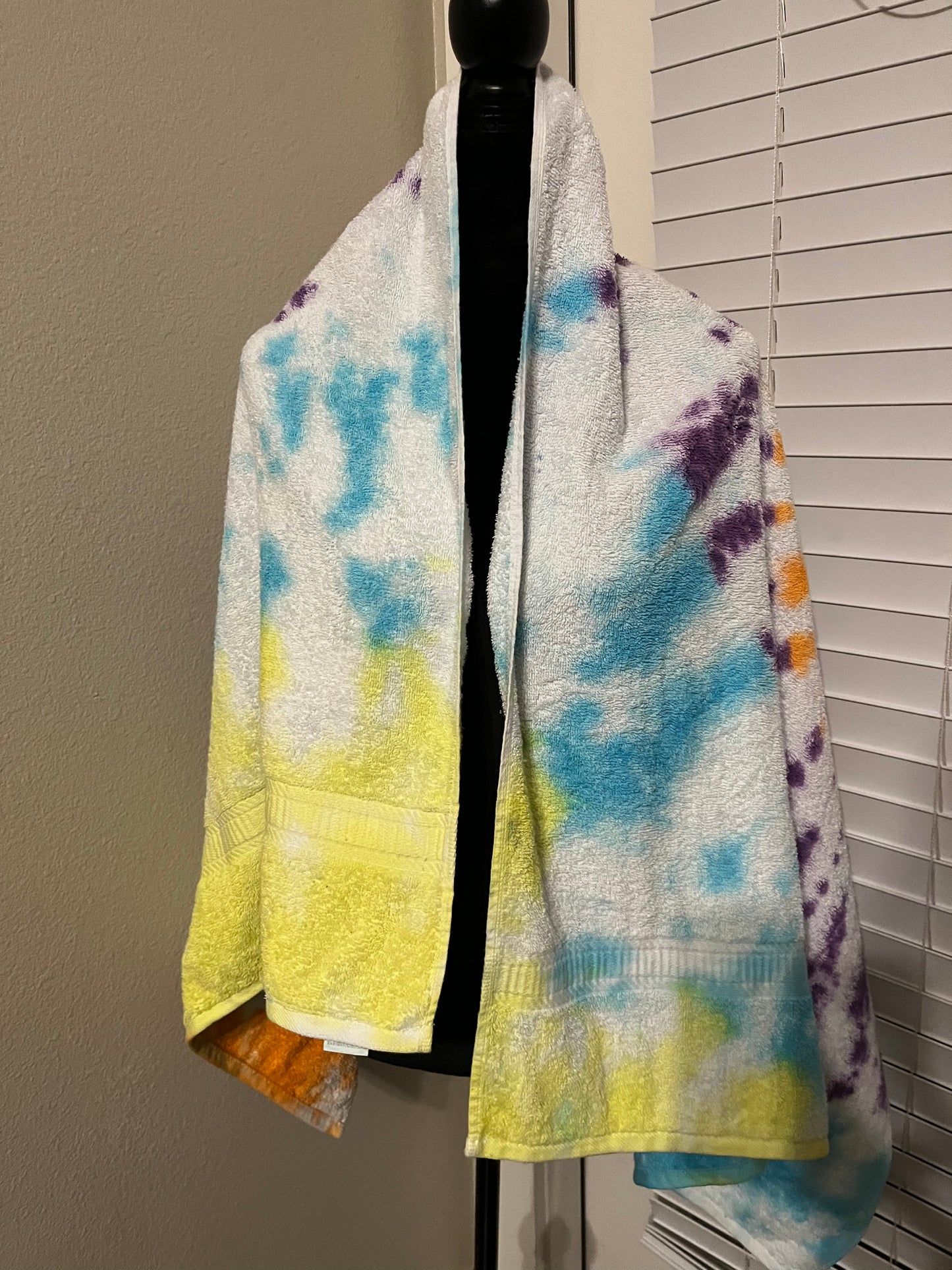 Yellow, purple, blue and orange tie dye towel